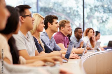 Class Of University Students Using Laptops In Lecture