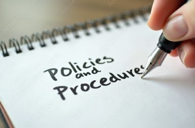 Policies and procedures memo written on notebook with fountain pen