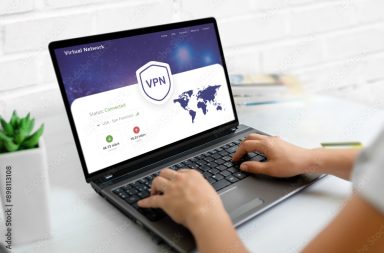 Using a VPN on a laptop. Web page concept with VPN connection and world map, emphasizing global online security and privacy