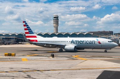 Washington DC, USA - June 04, 2024: American airline plane departure in airport. Airport terminal and runway strip. Aviation. Departure and arrival at airport. American aviation airline