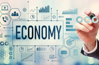 Economy with businessman on blurred abstract background