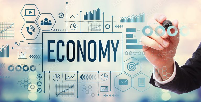 Economy with businessman on blurred abstract background