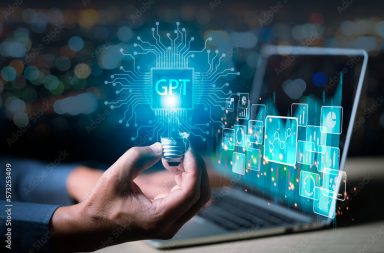 ChatGPT Chat with AI or Artificial Intelligence. Young businessman chatting with a smart AI or artificial intelligence using an artificial intelligence chatbot developed by OpenAI.